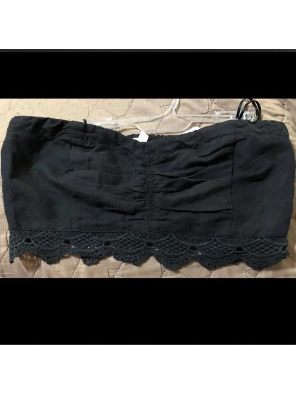 Free People black strapless top with crochet trim....